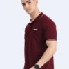 Man in maroon short-sleeve polo tee with white collar trim