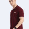 Man in maroon short-sleeve polo tee with white collar trim